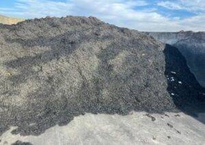 image of a huge pile of black mulch