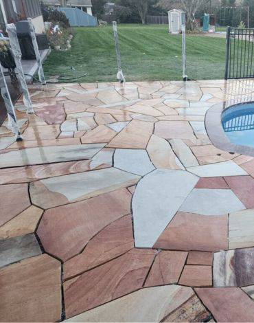 Pool patio deck with cut stone from Burst